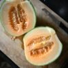 Charentais melon halves with deep orange flesh