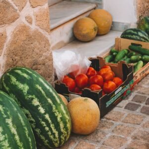 Watermelons and melons at a produce stall