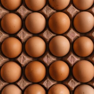 Brown chicken eggs on a moulded egg tray