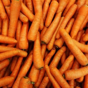 Pile of fresh topped carrots