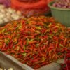 Small red and yellow chili peppers in a crate