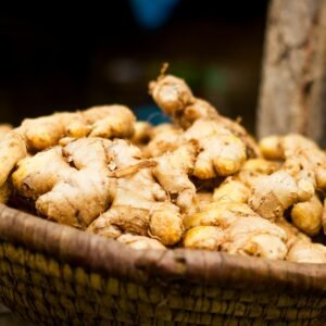 Basket of fresh ginger roots at a market